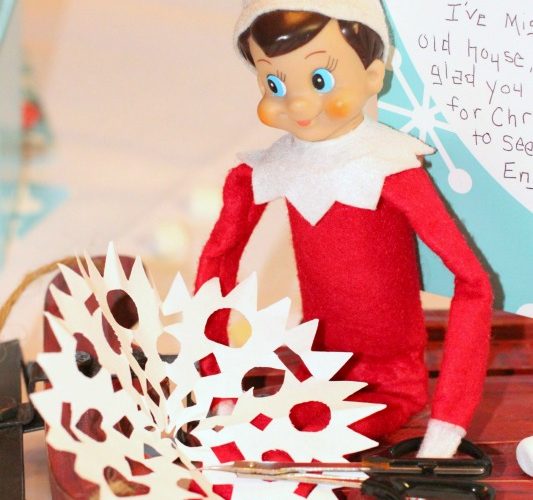 North pole breakfast elf making snowflakes