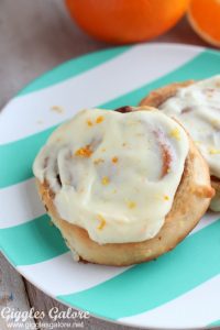 Cinnamon roll with orange cream cheese icing